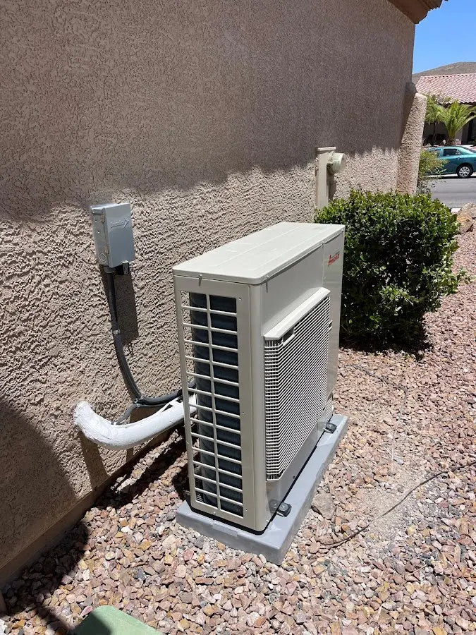 Residential air conditioning condenser unit in Naples Manor